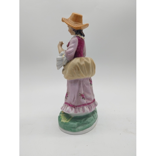 249 - Three decorative hand painted porcelain figures {27 cm H x 13 cm W x 10 cm D and 17 cm H x 7 cm W x ... 