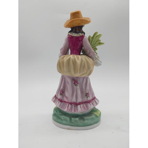 249 - Three decorative hand painted porcelain figures {27 cm H x 13 cm W x 10 cm D and 17 cm H x 7 cm W x ... 