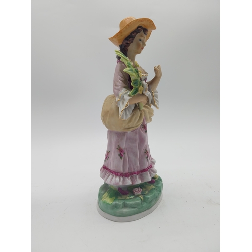 249 - Three decorative hand painted porcelain figures {27 cm H x 13 cm W x 10 cm D and 17 cm H x 7 cm W x ... 