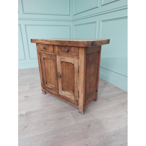 268 - Early 20th C. oak and pine cupboard with two long doors over two short drawers on square feet. {80 c... 