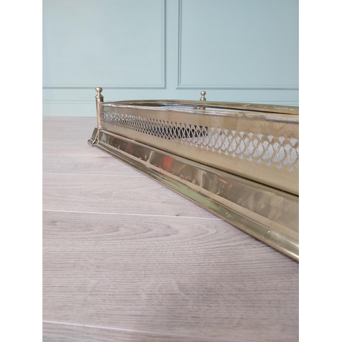 273 - Good quality 19th C. pierced brass fire fender {20 cm H x 194 cm W x 51 cm D}.