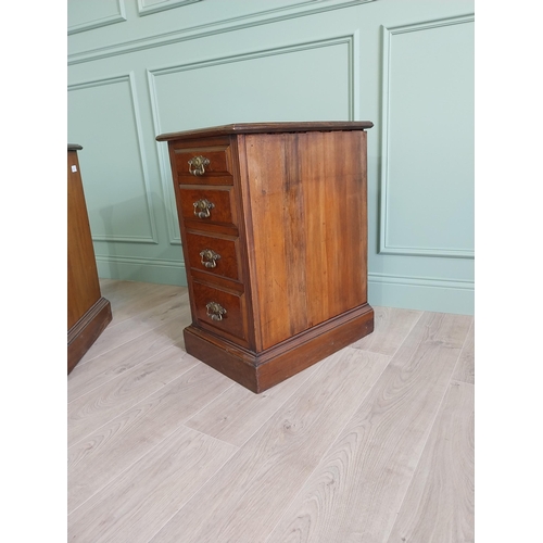 291 - Pair of Edwardian walnut bedside lockers with four graduated drawers and brass handles.
