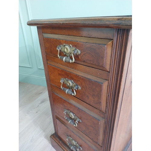 291 - Pair of Edwardian walnut bedside lockers with four graduated drawers and brass handles.