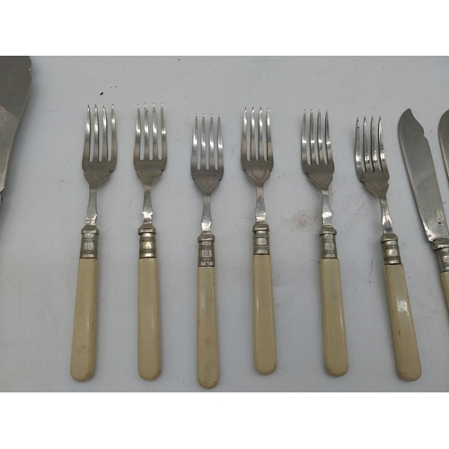 310 - Collection of Sheffield stainless steel cutlery with bone handles.