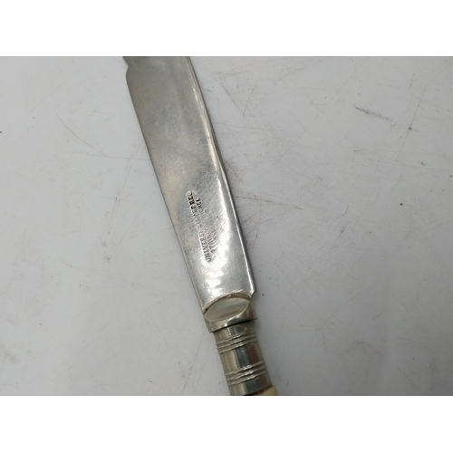 310 - Collection of Sheffield stainless steel cutlery with bone handles.