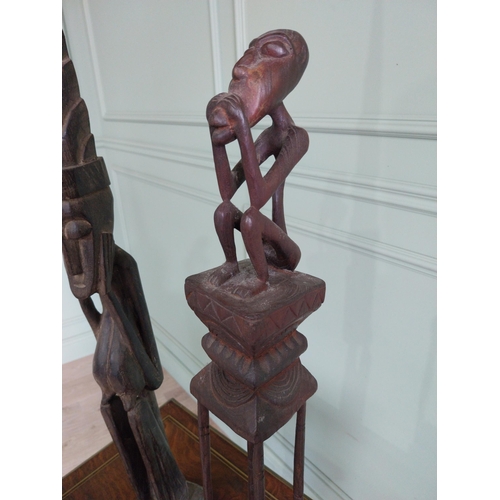 314 - Two African carved hardwood figures {101 cm H and 70 cm H}.