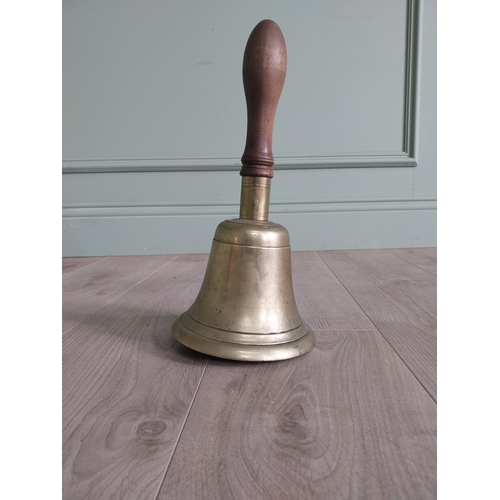 321 - Good quality early 20th C. brass hand bell with mahogany handle {33 cm H x 16 cm Dia.}.
