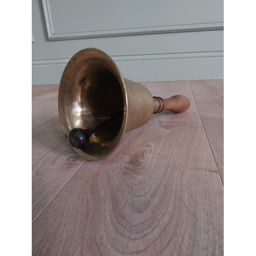 321 - Good quality early 20th C. brass hand bell with mahogany handle {33 cm H x 16 cm Dia.}.