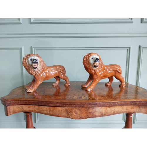328 - Pair of early 20th C. ceramic Staffordshire Lions {27 cm H x 36 cm W x 20 cm D}.