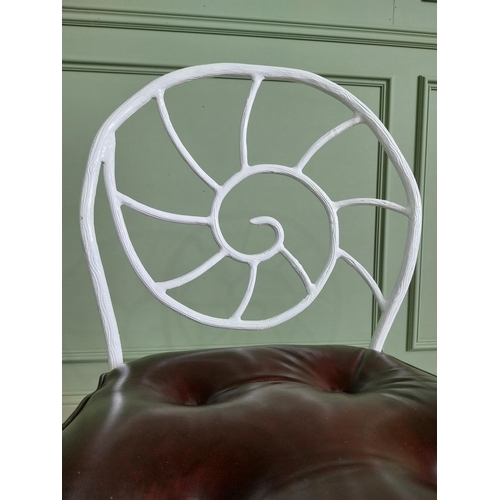 332 - Set of four good quality cast iron chairs with branch decoration and leather upholstered seats {90 c... 