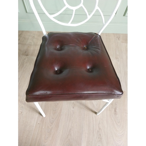 332 - Set of four good quality cast iron chairs with branch decoration and leather upholstered seats {90 c... 