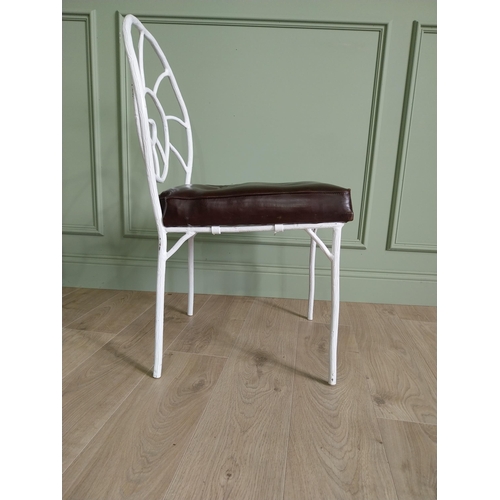 332 - Set of four good quality cast iron chairs with branch decoration and leather upholstered seats {90 c... 