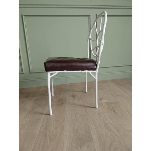 332 - Set of four good quality cast iron chairs with branch decoration and leather upholstered seats {90 c... 