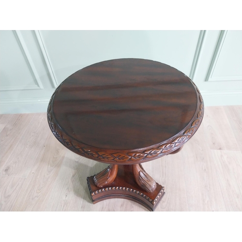 334 - Good quality mahogany lamp table raised on carved swan neck columns and platform base {65 cm H x 61 ... 