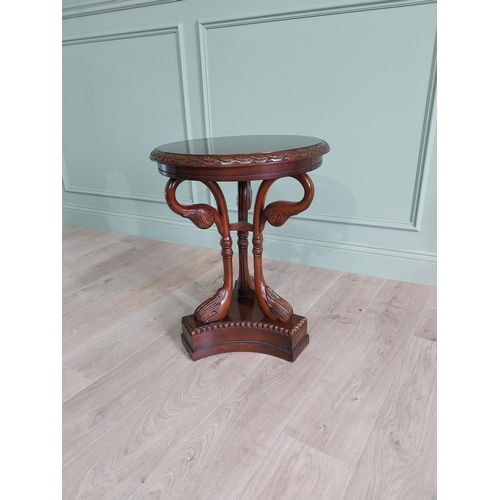 334 - Good quality mahogany lamp table raised on carved swan neck columns and platform base {65 cm H x 61 ... 