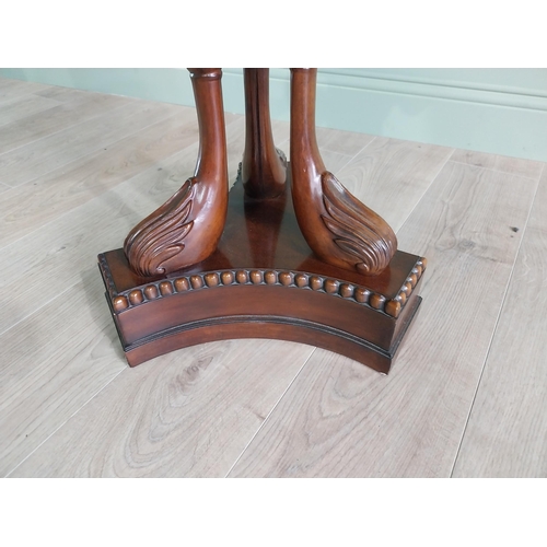 334 - Good quality mahogany lamp table raised on carved swan neck columns and platform base {65 cm H x 61 ... 