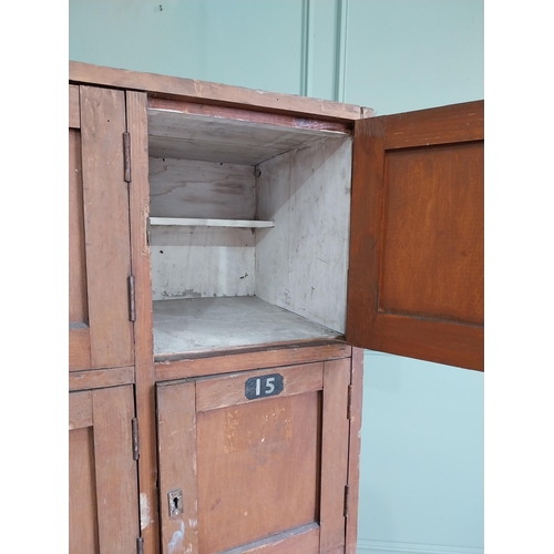 34 - 1950s stained pine bank of lockers {169 cm H x 63 cm W x 43 cm D}.