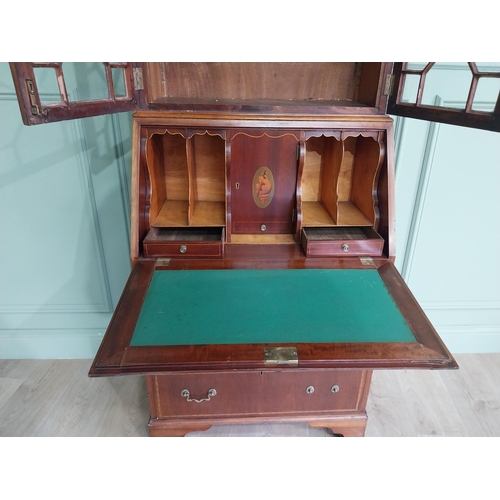 347 - Edwardian mahogany bureau bookcase with two astral glazed doors, over fitted interior and three long... 