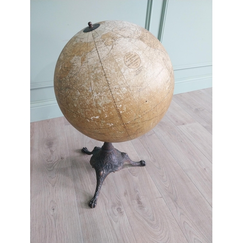348 - Early 20th C. world globe on decorative cast iron stand {72 cm H x 40 cm Dia.}.
