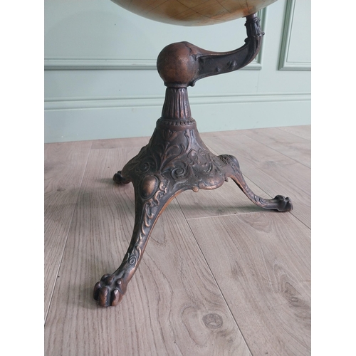 348 - Early 20th C. world globe on decorative cast iron stand {72 cm H x 40 cm Dia.}.