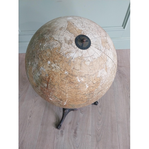 348 - Early 20th C. world globe on decorative cast iron stand {72 cm H x 40 cm Dia.}.