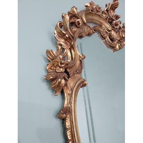 361 - Decorative giltwood wall mirror in the Rococo style {118 cm H x 81 cm W}. U