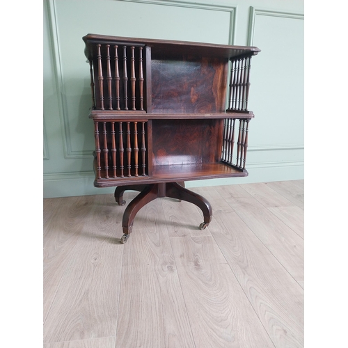 364 - 19th C. rosewood revolving bookcase by Howard and Sons {75 cm H x 60 cm W x 60 cm D}.