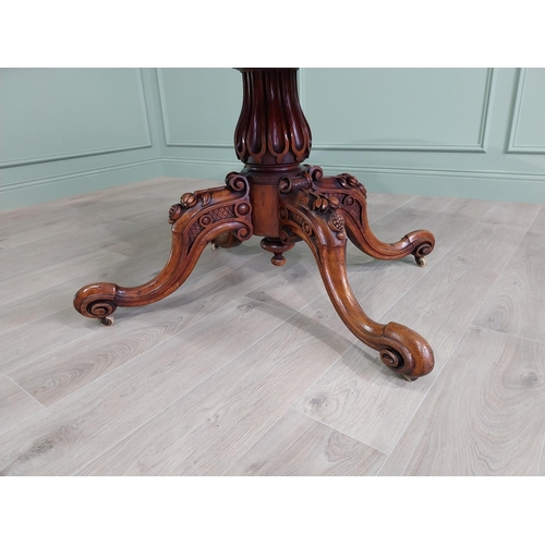 42 - Good quality burr walnut shaped centre table raised on turned column and four outswept feet {73 cm H... 