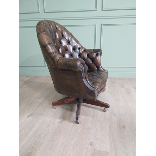432 - Exceptional quality hand dyed deep buttoned leather upholstered swivel office chair. {105 cm H x 85 ... 