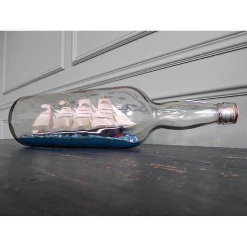 443 - Vintage ship in a bottle {24 cm H x 52 cm W x 14 cm D}.