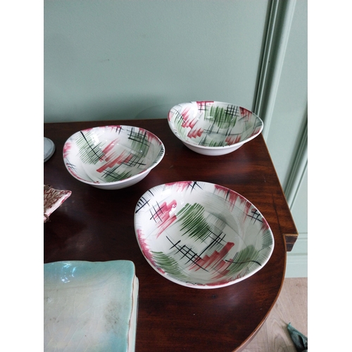 461 - Collection of nine pieces of early 20th C. ceramic dishes and vase.