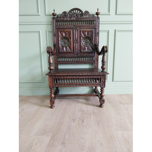 462 - 19th C. carved oak throne chair in the Tudor style {140 cm H x 80 cm W x 52 cm D}.