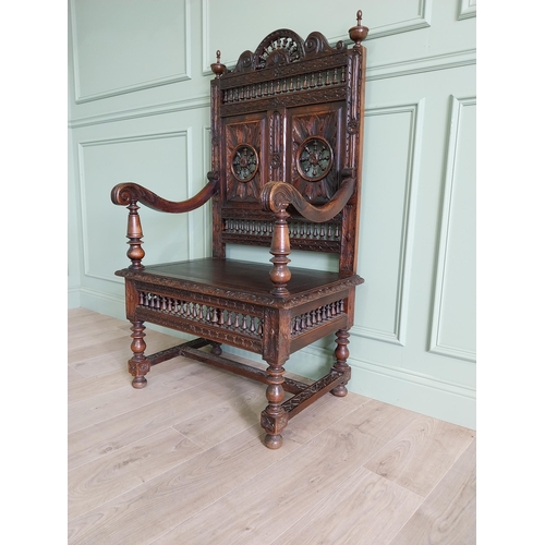 462 - 19th C. carved oak throne chair in the Tudor style {140 cm H x 80 cm W x 52 cm D}.