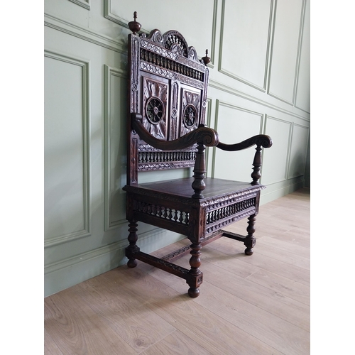 462 - 19th C. carved oak throne chair in the Tudor style {140 cm H x 80 cm W x 52 cm D}.