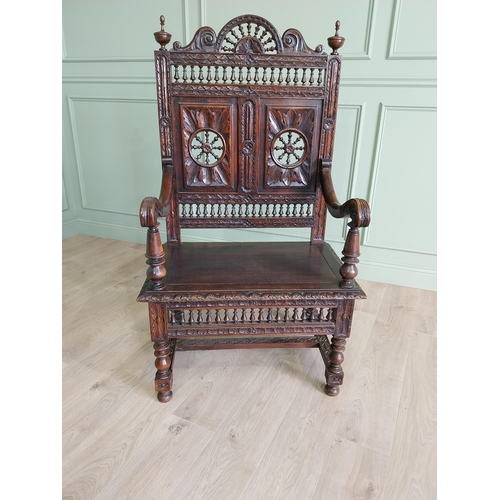 462 - 19th C. carved oak throne chair in the Tudor style {140 cm H x 80 cm W x 52 cm D}.
