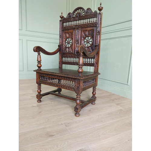 462 - 19th C. carved oak throne chair in the Tudor style {140 cm H x 80 cm W x 52 cm D}.