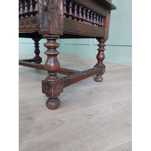 462 - 19th C. carved oak throne chair in the Tudor style {140 cm H x 80 cm W x 52 cm D}.