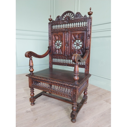 462 - 19th C. carved oak throne chair in the Tudor style {140 cm H x 80 cm W x 52 cm D}.