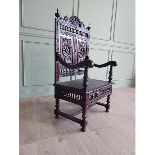 462 - 19th C. carved oak throne chair in the Tudor style {140 cm H x 80 cm W x 52 cm D}.