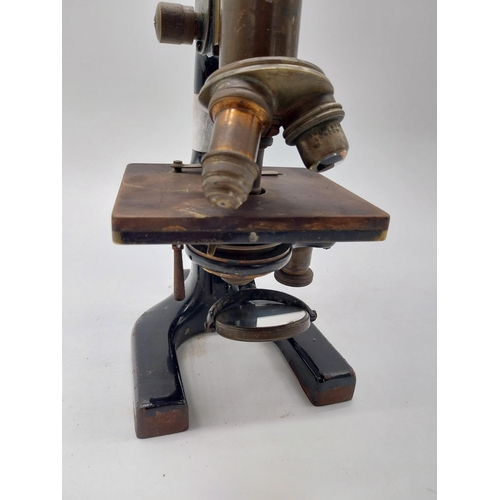 468 - Early 20th C. brass and metal microscope {36 cm H x 11 cm W x 19 cm D}.