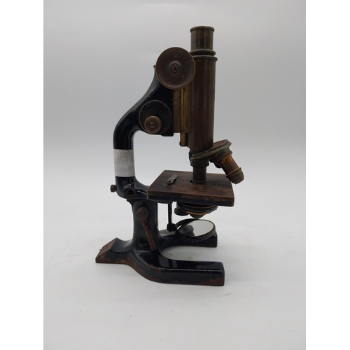 468 - Early 20th C. brass and metal microscope {36 cm H x 11 cm W x 19 cm D}.