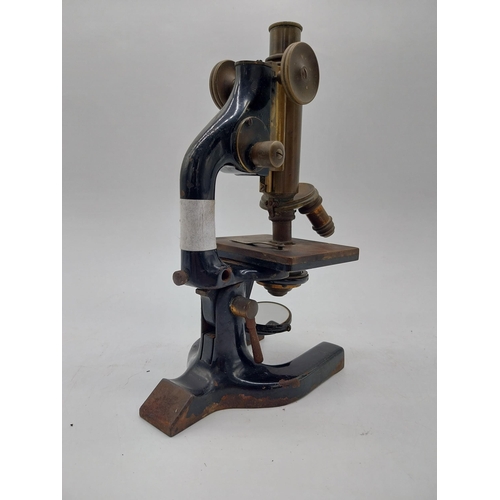 468 - Early 20th C. brass and metal microscope {36 cm H x 11 cm W x 19 cm D}.