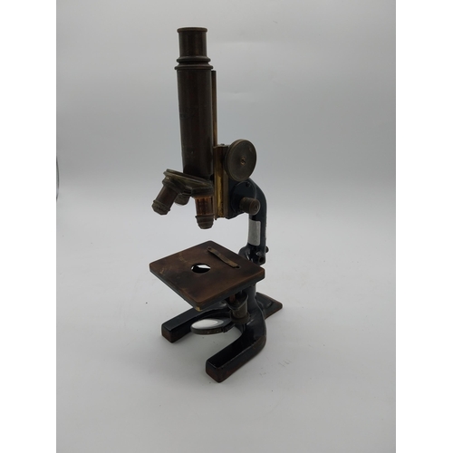 468 - Early 20th C. brass and metal microscope {36 cm H x 11 cm W x 19 cm D}.