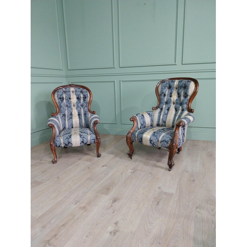 472 - Two Victorian mahogany and upholstered ladies and gents arm chairs raised on cabriole legs {100 cm H... 