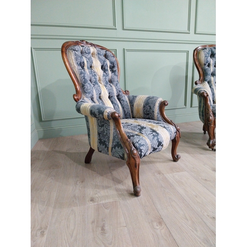 472 - Two Victorian mahogany and upholstered ladies and gents arm chairs raised on cabriole legs {100 cm H... 