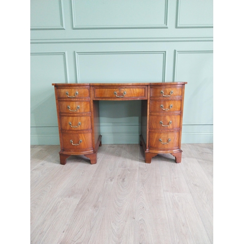 479 - Good quality mahogany knee hole desk with eight short drawers and one long drawer in frieze raised o... 