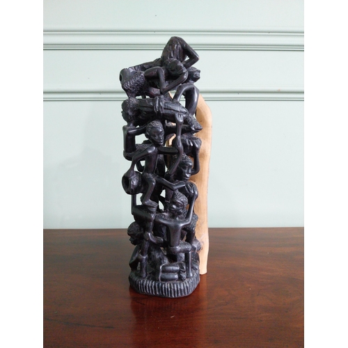 481 - African carved hardwood sculpture 'The Climbing men' {35 cm H x 13 cm W x 13 cm D}.