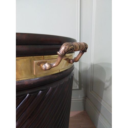 557 - Irish mahogany spiral brass bound peat bucket in the Georgian style {66cm H x 62cm Dia}