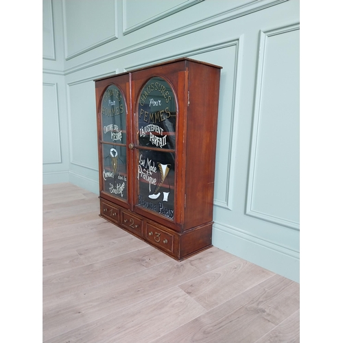 56 - Mahogany tailors glass cabinet with two glazed doors over three drawers {95 cm H x 86 cm W x 26 cm D... 