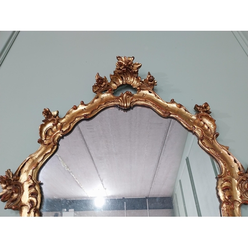 62 - Decorative giltwood wall mirror in the Rococo style {105 cm H x 70 cm W}. U